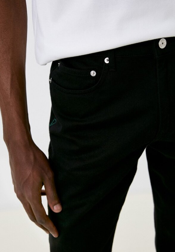 Джинсы Lacoste