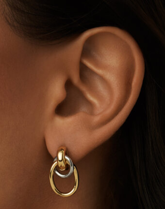 Серебряные крупные серьги-узлы в покрытии биколор MIE женщинам